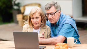 Older couple buying cryptocurrency