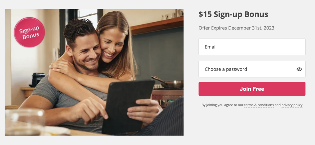 Man and woman in joy applying a TopCashback promo code to save money on their online purchases