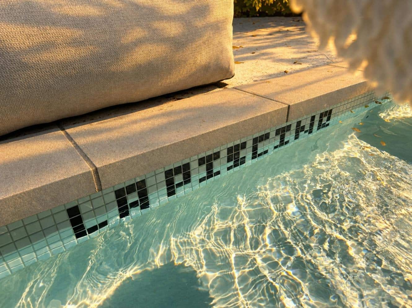 Pool tiles spelling La Piscine at the Kindred house